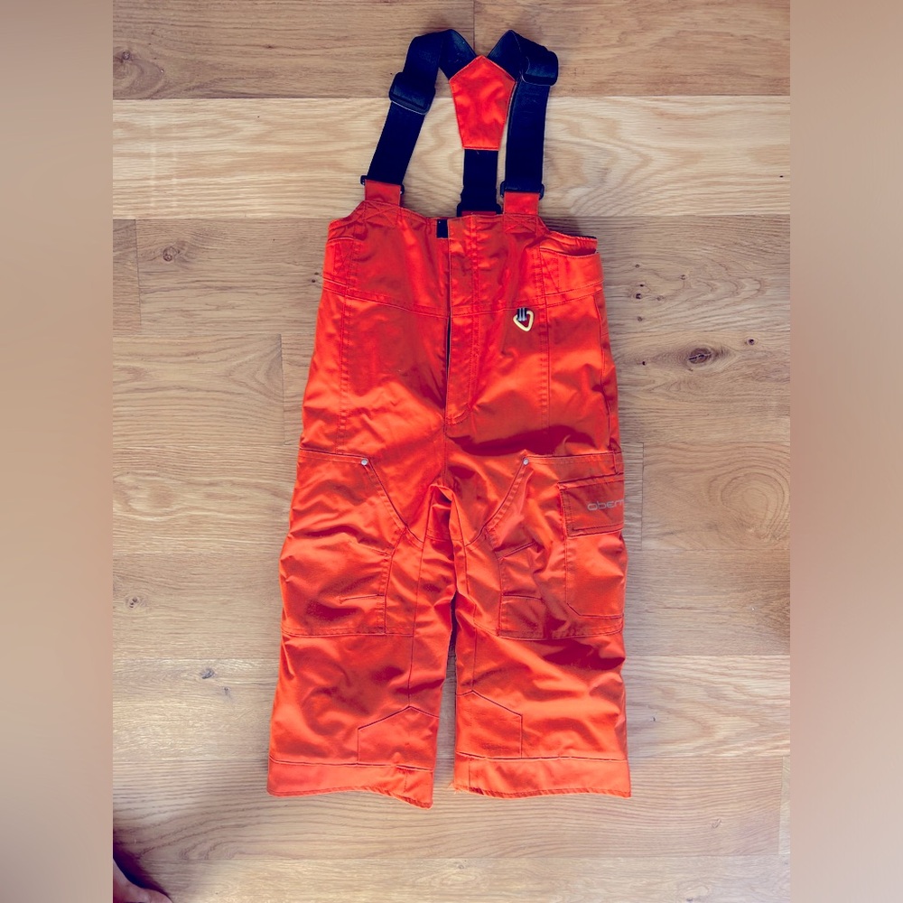 Kids Obermeyer orange ski pants / ski bibs, adjustable straps for growth size 4